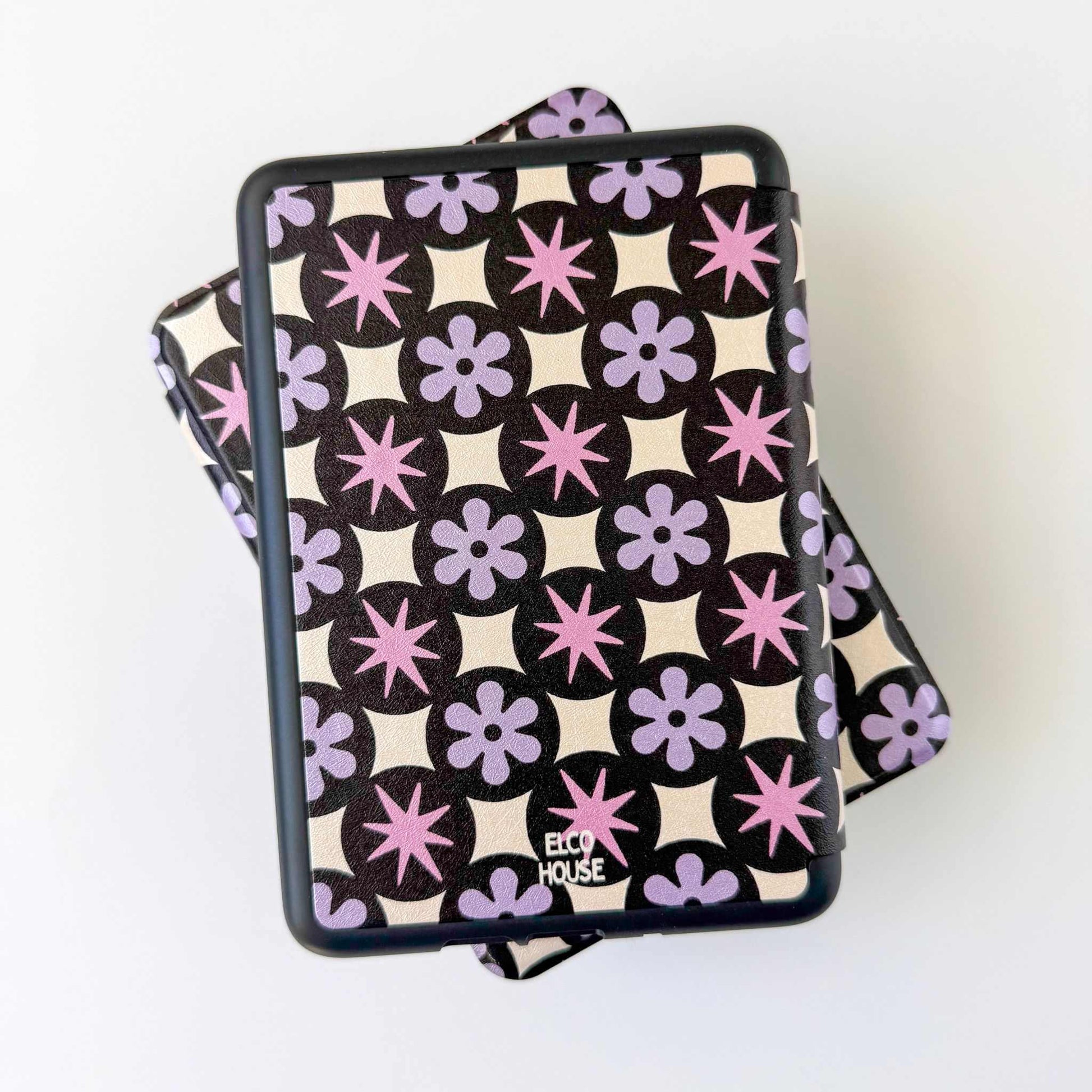 Patterned Kindle case product with 'ELCO HOUSE' branding on a white background