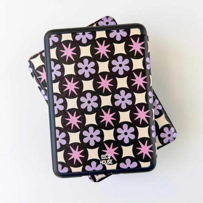 Patterned Kindle case product with 'ELCO HOUSE' branding on a white background