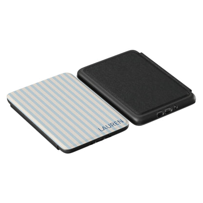 Blue and beige striped Kindle case showing the name "lauren" written on the front, and a black back cover side by side 