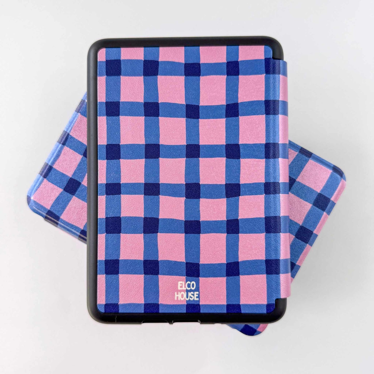Pink and blue checkered Kindle case with 'Elco House' branding on a white background