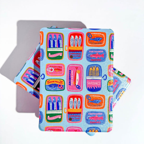 Front cover of blue kindle case with colorful sardine tins 