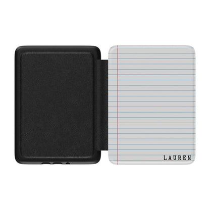 Black Kindle case with a lined notebook design labeled 'Lauren' on the front,  on a white background