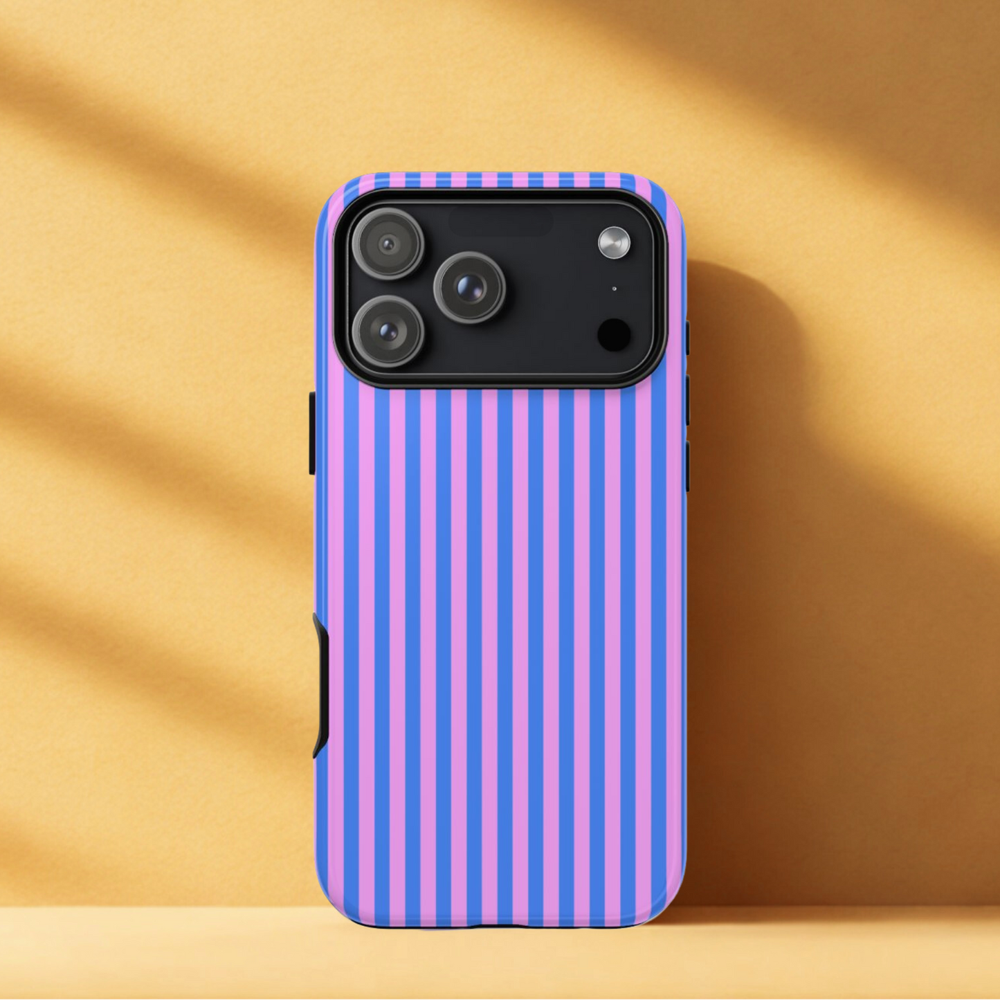 Phone case with purple and pink striped pattern on a beige background