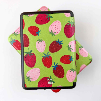 Kindle case with strawberry pattern on a green background with "ELCO HOUSE" logo printed in white at bottom of the case 