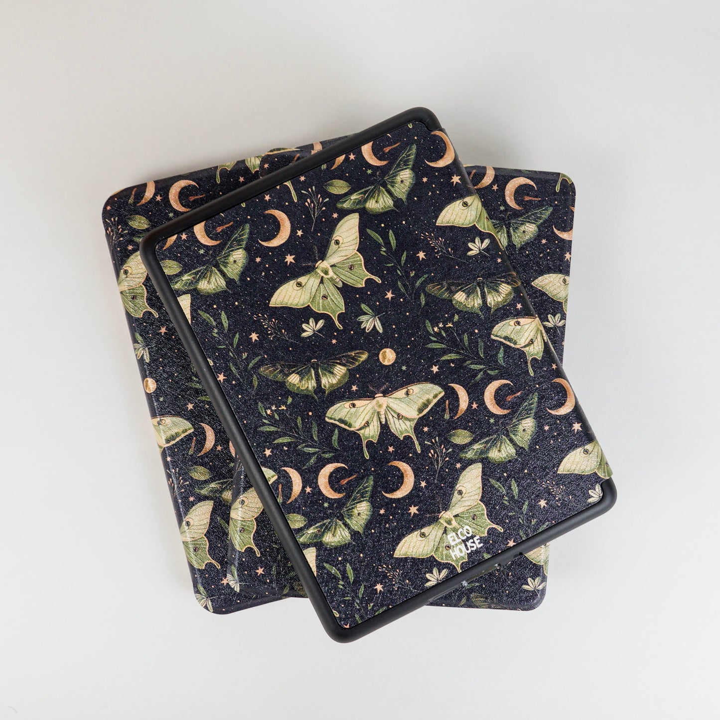 Flat lay of Lunar Enchantment Kindle Case with celestial luna moth print on black background, elco house logo 