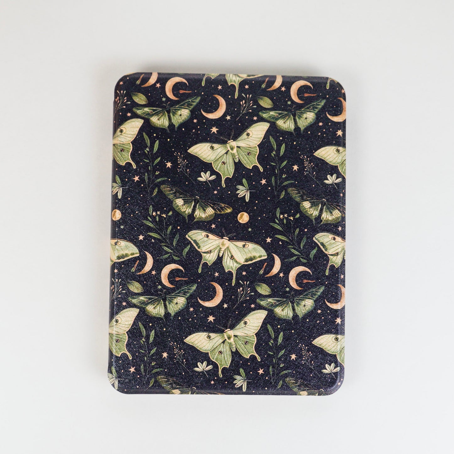 Lunar Enchantment Kindle Case with green luna moths and moon design on black background by Elco House.