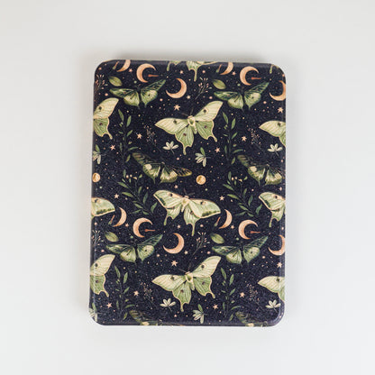 Lunar Enchantment Kindle Case with green luna moths and moon design on black background by Elco House.