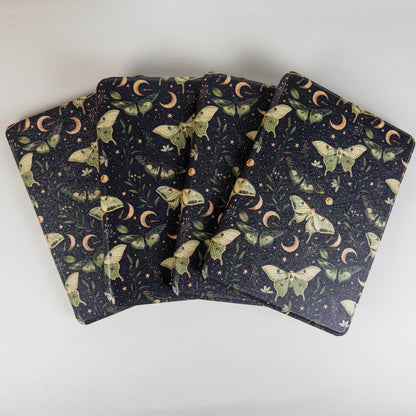 Lunar Enchantment Kindle Cases spread with green luna moths and moon design on black background by Elco House.