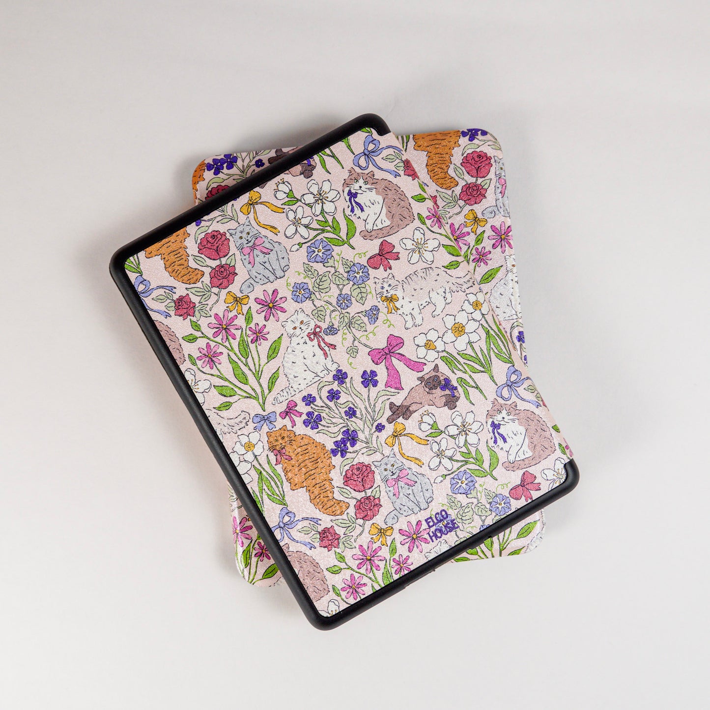 back view of Whisker Garden Kindle Case showing pink flowers and cat print, with elco house logo
